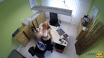 Red-haired woman with big milkings right in the office has sex on the table